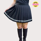 Black pleated skirt with white stripes