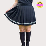 Black pleated skirt with white stripes