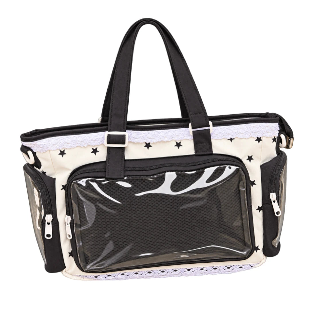 Black and white shoulder bag with clear front and side windows. Fabric has star pattern. Clear windows are to display plushies, keychains and pins