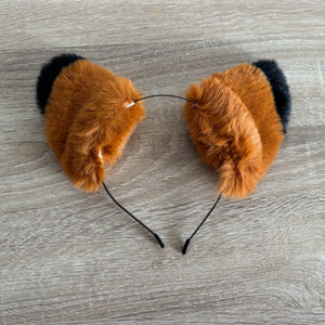 Fox or cat ears with black tips on a headband
