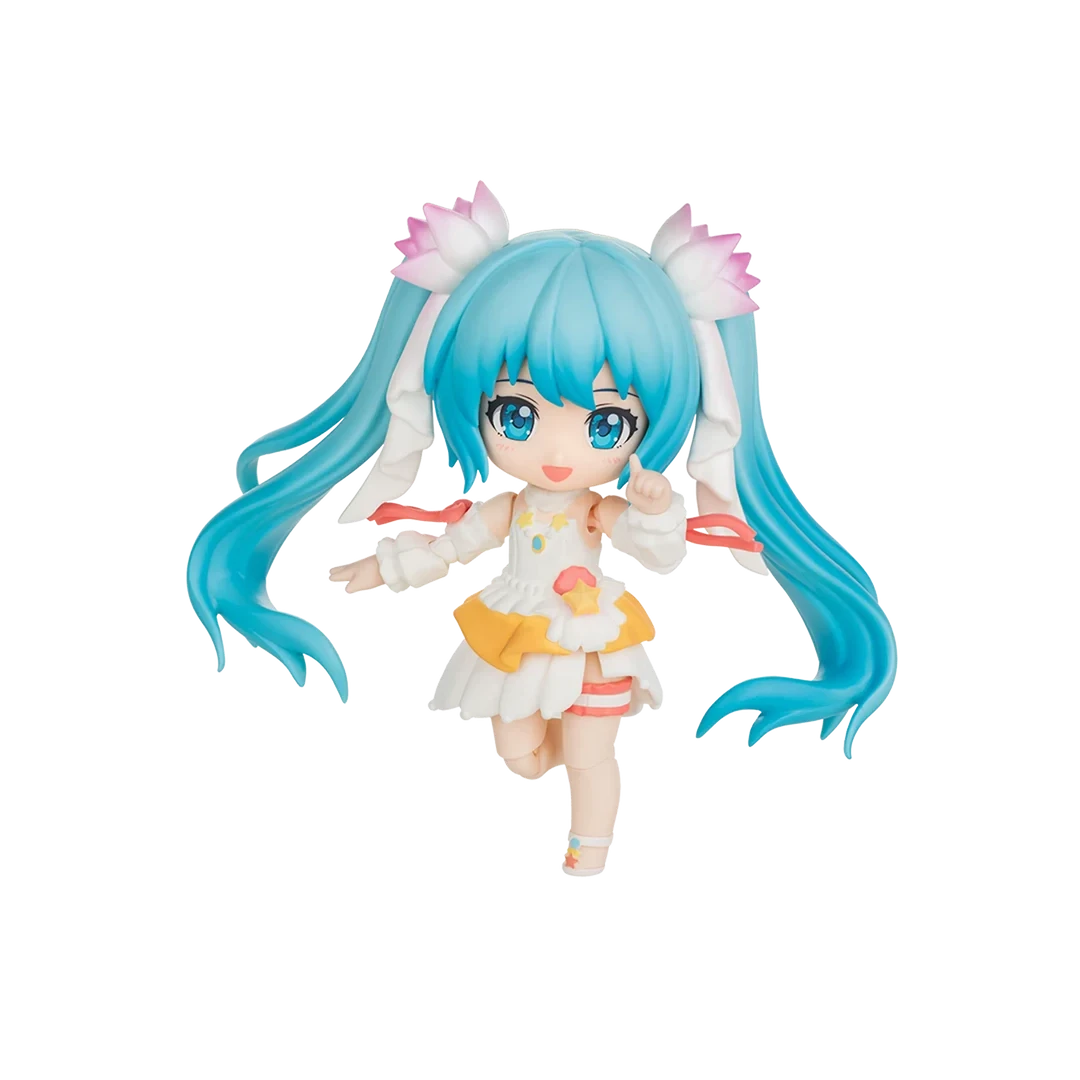 A chibi-style vinyl figure of Hatsune Miku with long bright blue twin-tails, pink flower accessories, and a white outfit with yellow and orange accents, isolated on a black background.
