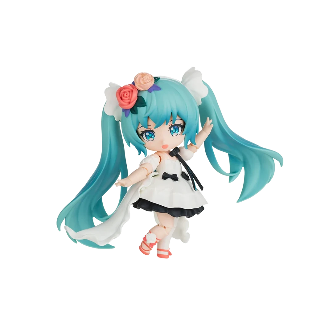 A chibi-style vinyl figure of Hatsune Miku with long turquoise hair, wearing a white dress with black bows and floral hair accessories, posed against a plain white background.
