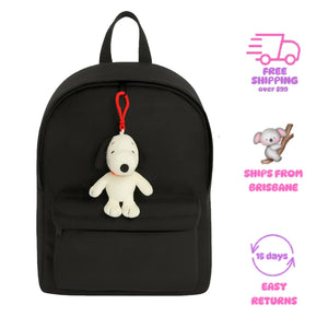 Black backpack with Snoopy plush toy keychain on a white background