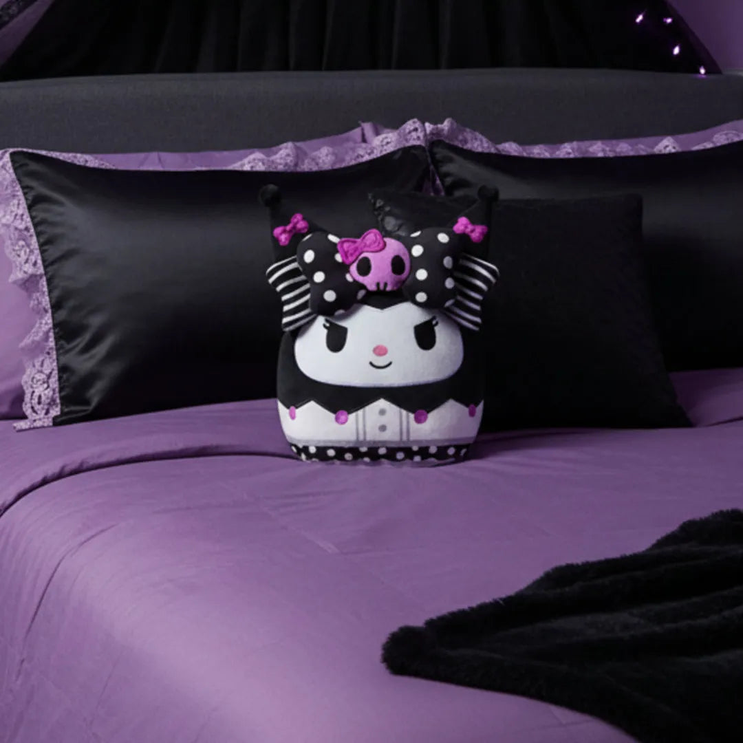 Decorative pillow with cartoon character on a purple bedspread