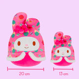 Two pink My melody plush toys with festive patterns and measurements on a pink background