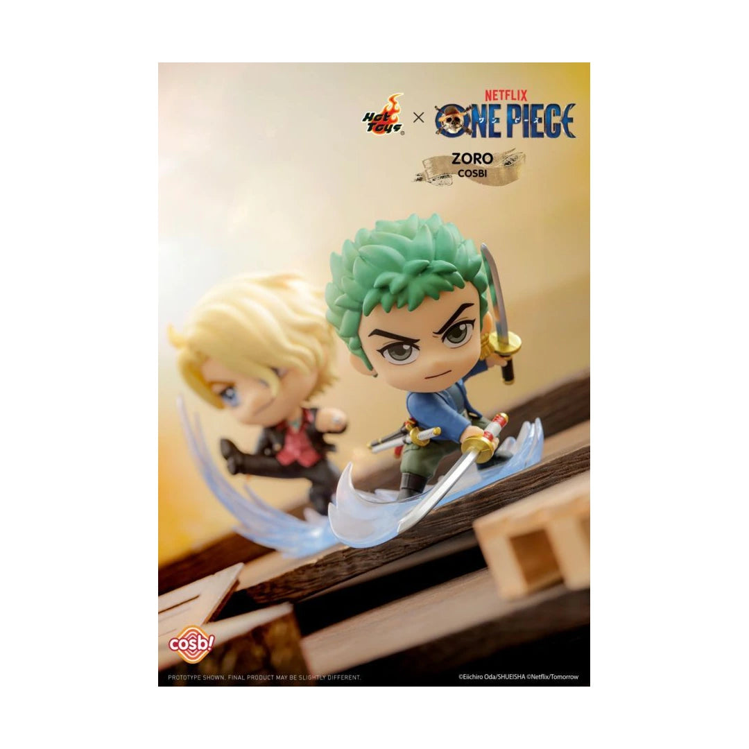 Cosplay figure of Zoro from One Piece: Pirate Front, featuring green hair and a sword, posed with a translucent blade effect, with a blurred blonde character in the background. Hot Toys x Netflix One Piece collaboration branding is visible at the top.