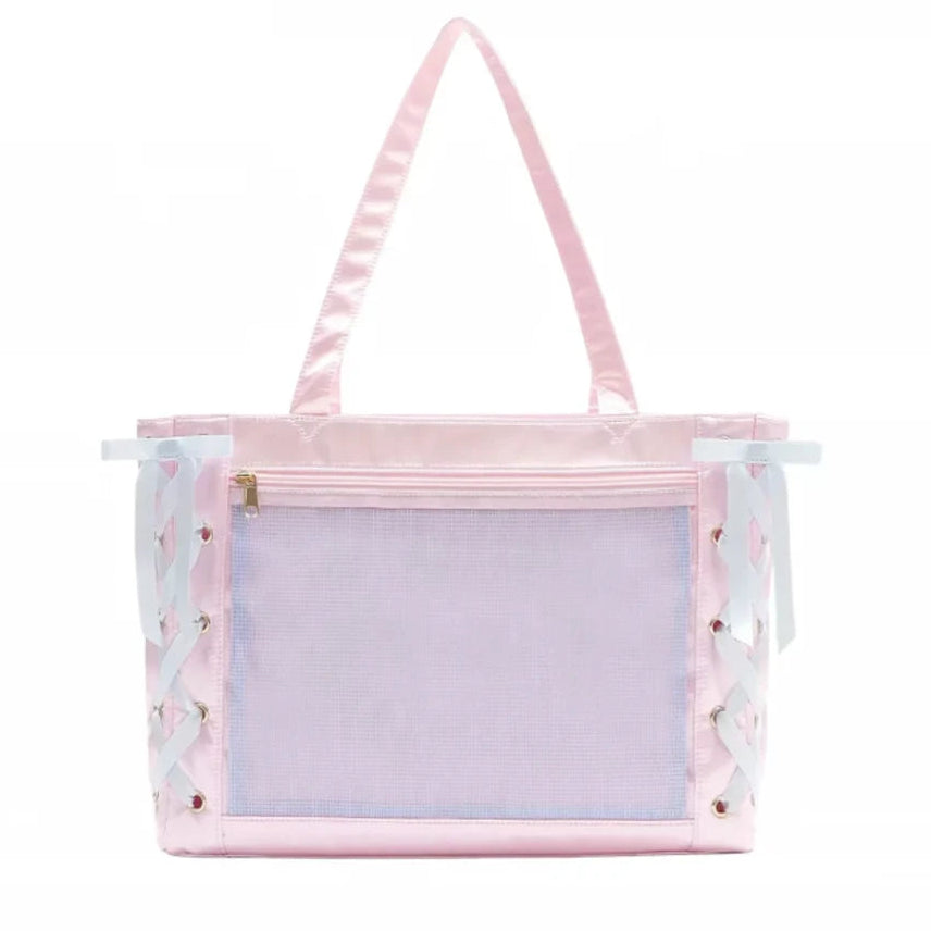 A pastel pink ita bag with a large front mesh window, satin shoulder straps, and decorative white/light blue bows with small pink floral details on the sides.
