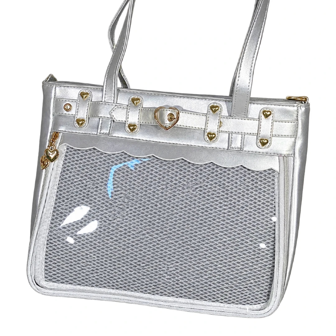A silver metallic mesh ita bag with a clear front pocket, gold-tone hardware, and double shoulder straps, shown on a plain white background.