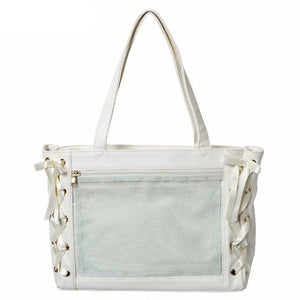 An off-white ita bag featuring a large front mesh pocket, dual shoulder straps, and decorative lace-up side details with silver-tone metal eyelets.