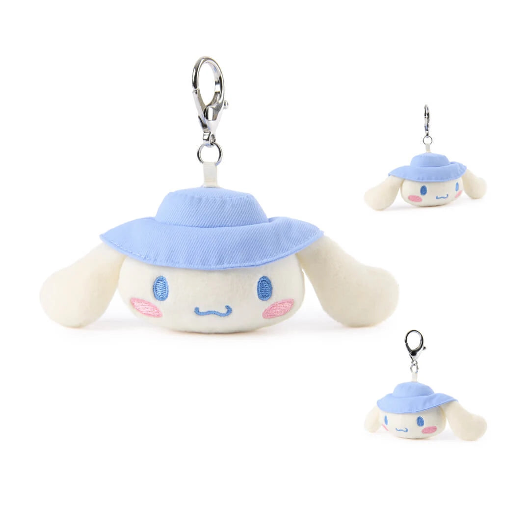Plush keychain with a Cinnamorroll character wearing a blue hat on a white background