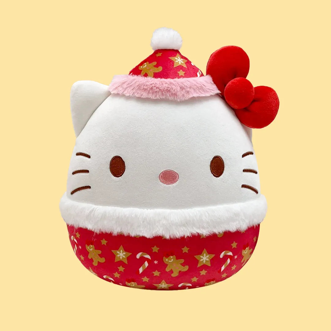 Hello Kitty Squishmallows Plush toy with a Santa hat and red dress on a yellow background