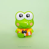 Cartoon frog Keroppi character with a colorful outfit on a light green background