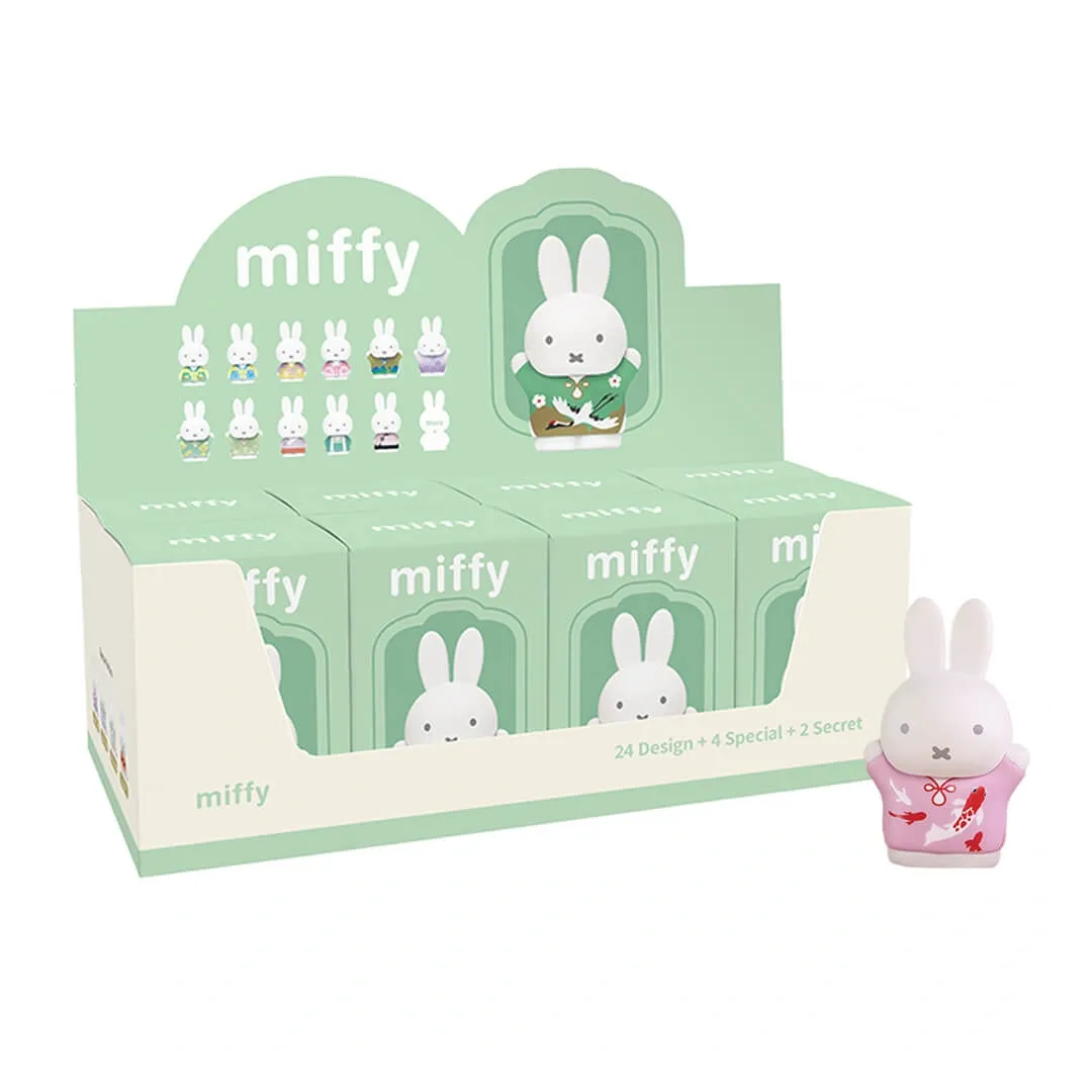 Display box of Miffy figurines with a single Miffy figurine in front