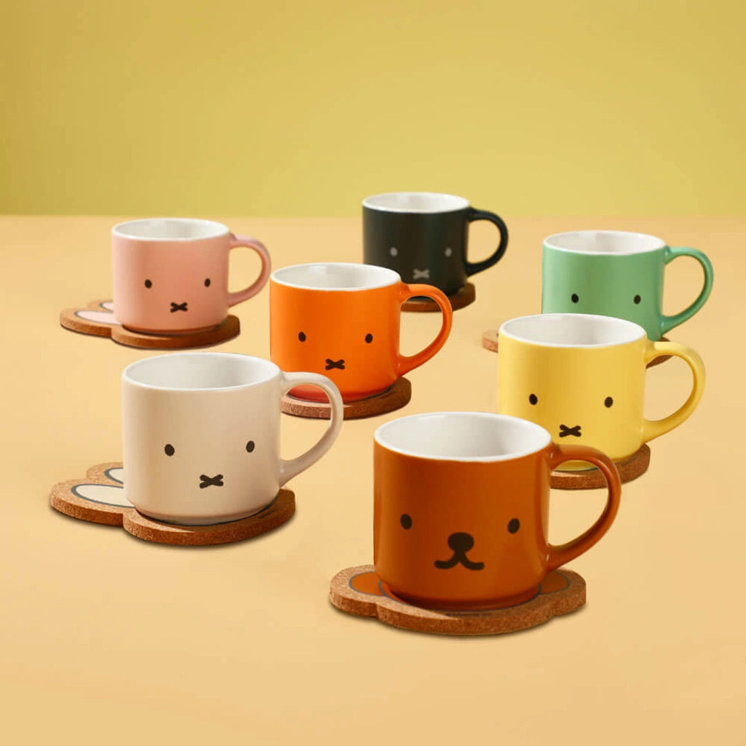 Set of colorful mugs with coaters. Miffy mystery box