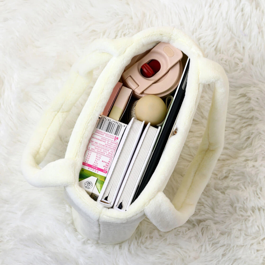 Miffy Small white pouch with cosmetic items on a white fluffy surface