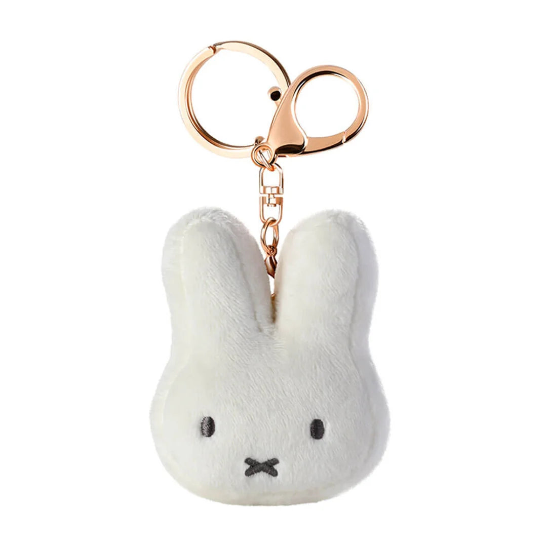 White plush Miffy bunny keychain with a rose gold clip on a white background
