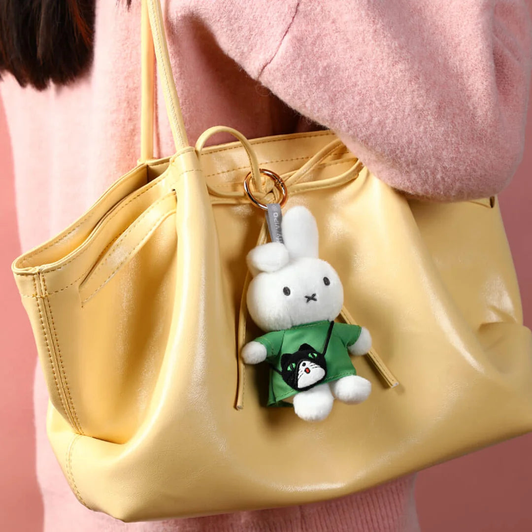 Miffy blind box Pluush bag clip with bag series. Miffy with green dress and a cute black bag style displayed