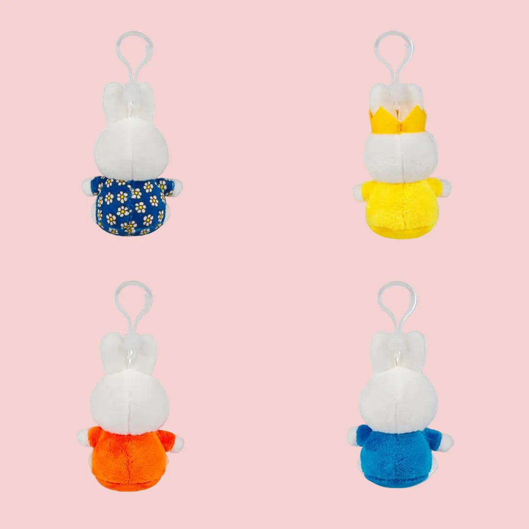 Back view of four Miffy plush keyrings showing outfits and clips