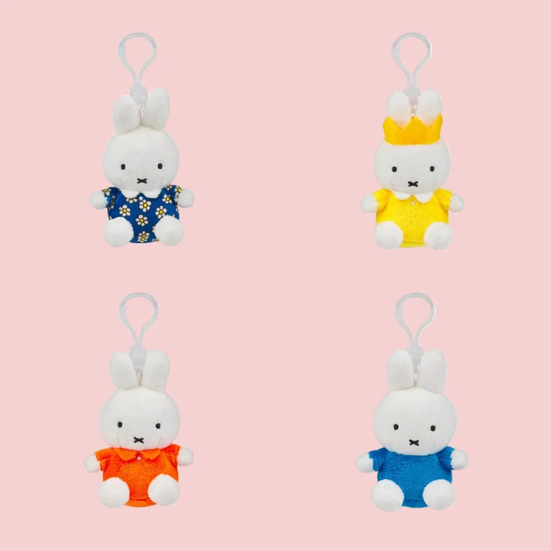 Front view of four Miffy keyring styles: floral, yellow crown, red/orange, blue.