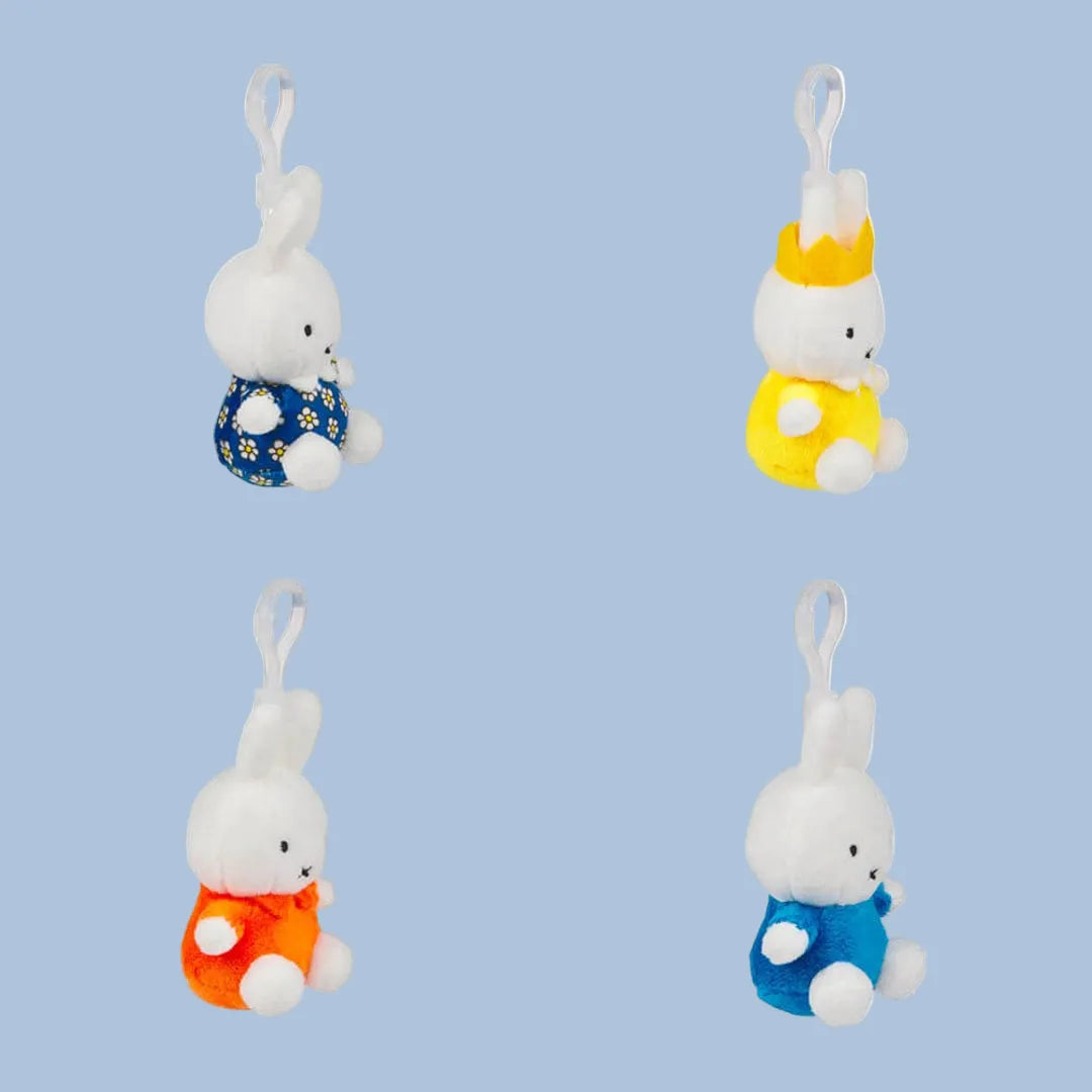 Side view of four Miffy keyring styles showing the plastic clips
