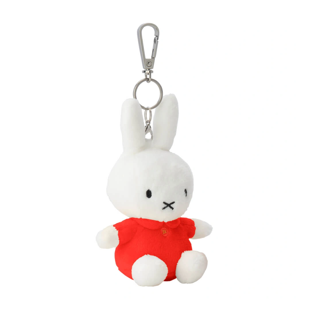 Plush rabbit keychain with a red outfit on a white background
