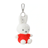 Plush rabbit keychain with a red outfit on a white background