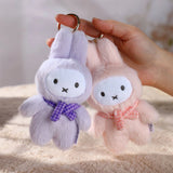 Two plush keychains, one purple and one pink. Miffy surprise boxes. Dispatch from Brisbane