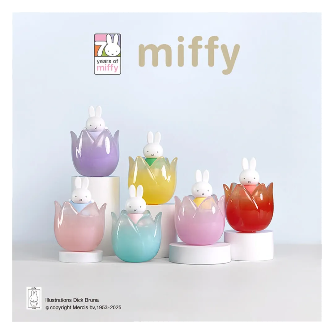 Set of colorful miffy figurines in egg-shaped holders on a light blue background with 'miffy' branding.