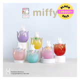 Set of colorful miffy figurines in egg-shaped holders on a light blue background with 'miffy' branding.