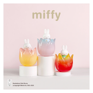 Three colorful rabbit-shaped pots with 'miffy' branding on a light pink background.