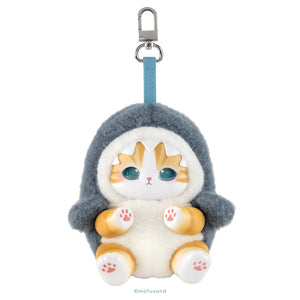 A plush cat-shaped keychain or bag charm with a gray shark hood, white body, orange-tan face and paws, blue strap, and silver metal clasp on a plain white background.