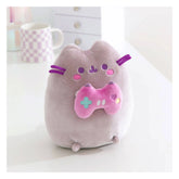 Front view of Pusheen Gamer Girl plush holding a pink game controller