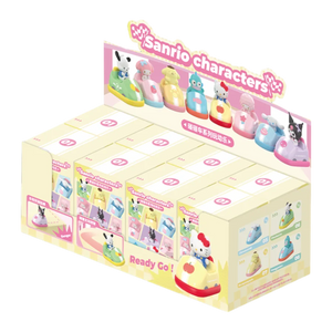 Display box of Sanrio character figurines with colorful packaging on a white background