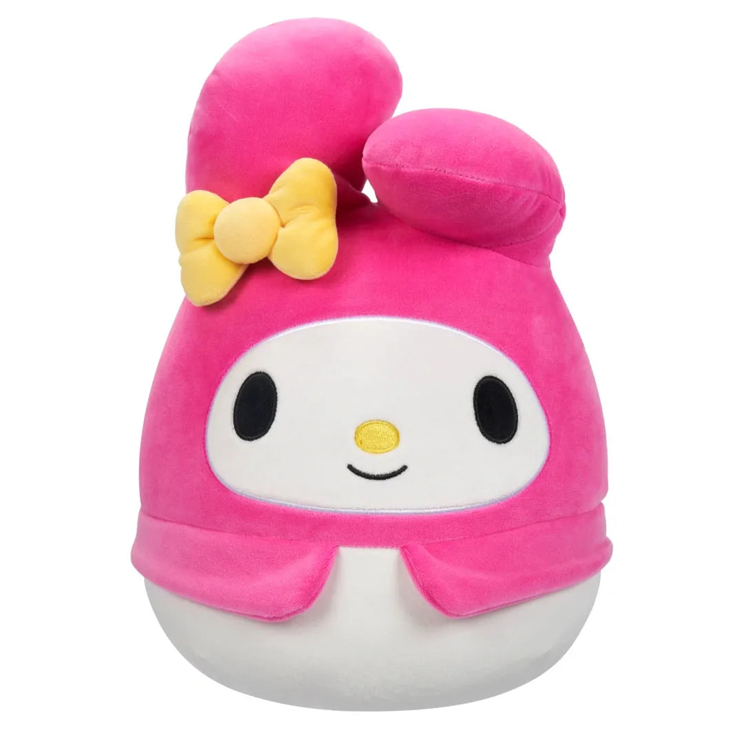 Plush toy with pink hair and a yellow bow on a white background
