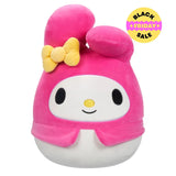Plush toy with pink hair and a yellow bow on a white background
