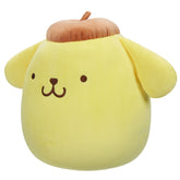 Side view of Pompompurin Squishmallow showing embroidered smile