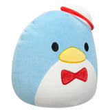 Plush toy penguin with a red bow tie and hat on a white background