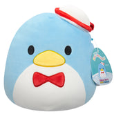 Plush toy penguin with a red bow tie and hat on a white background