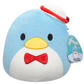 Plush toy penguin with a red bow tie and hat on a white background