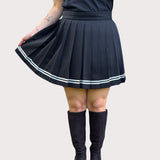 Black pleated skirt with white stripes