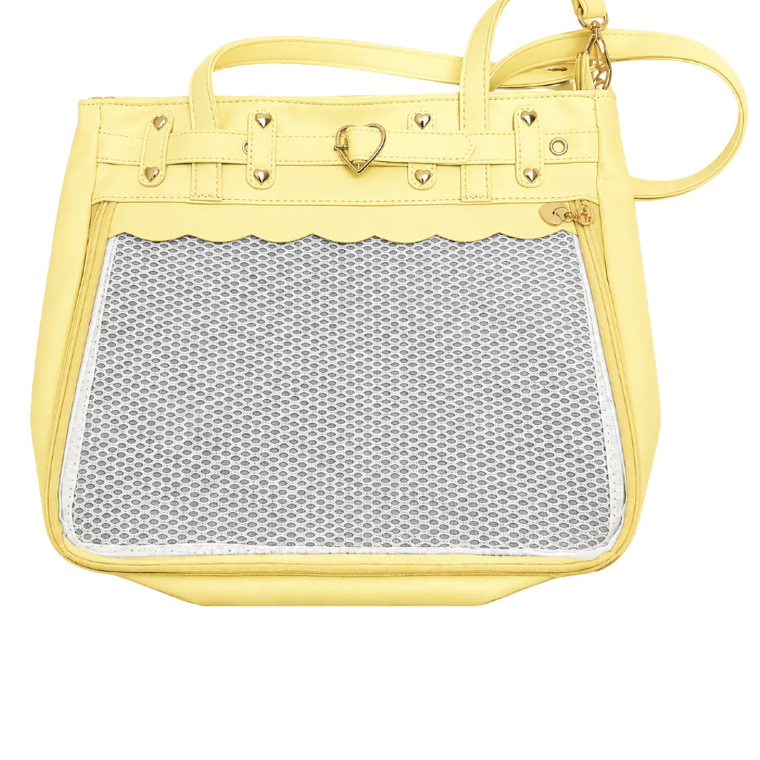 A light yellow faux-leather ita handbag with a large scalloped mesh window on the front, gold-tone hardware, and a top handle, shown against a plain white background.
