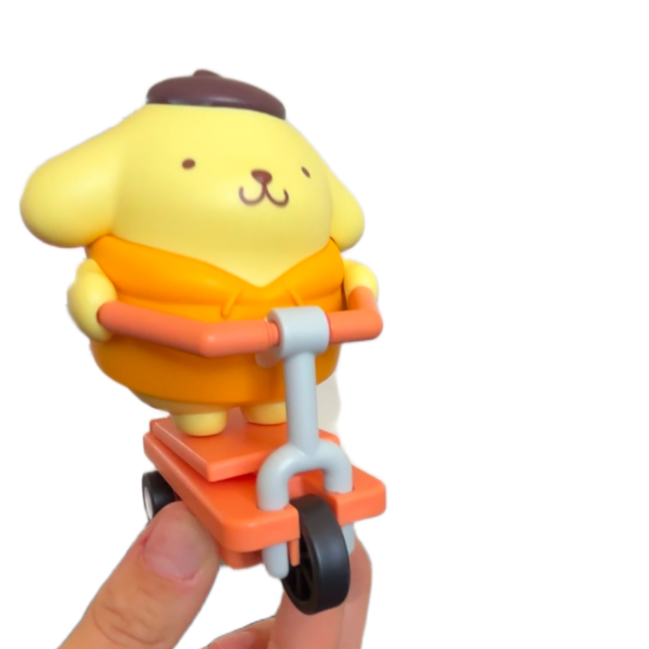 Yellow dog-like character on a scooter held by a hand against a white background