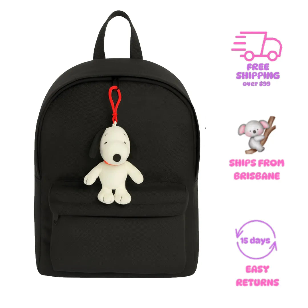 Black backpack with Snoopy plush toy keychain on a white background