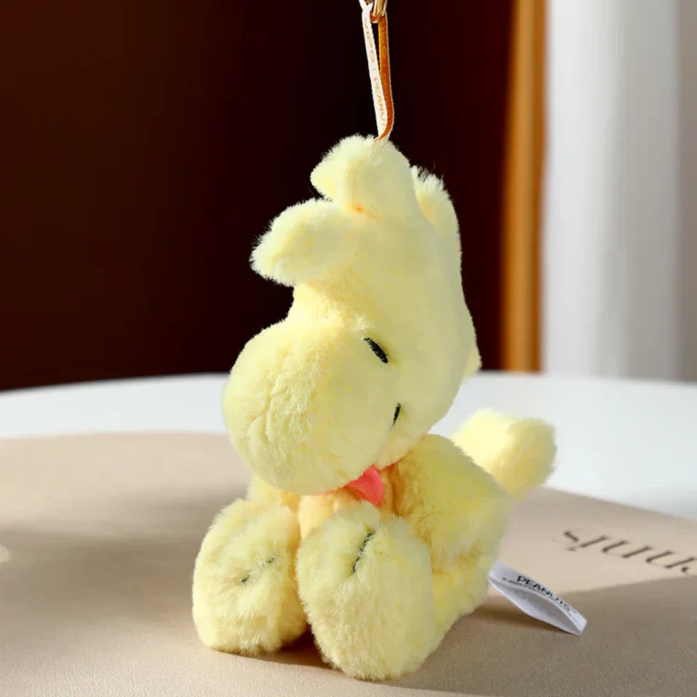 Yellow plush toy keychain of Woodstock from Snoopy 