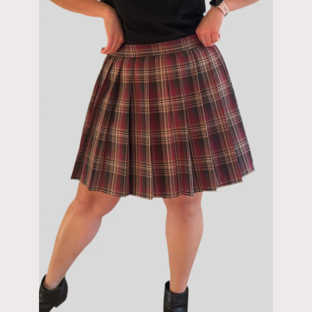Brown Plaid skirt worn by a person on a plain background