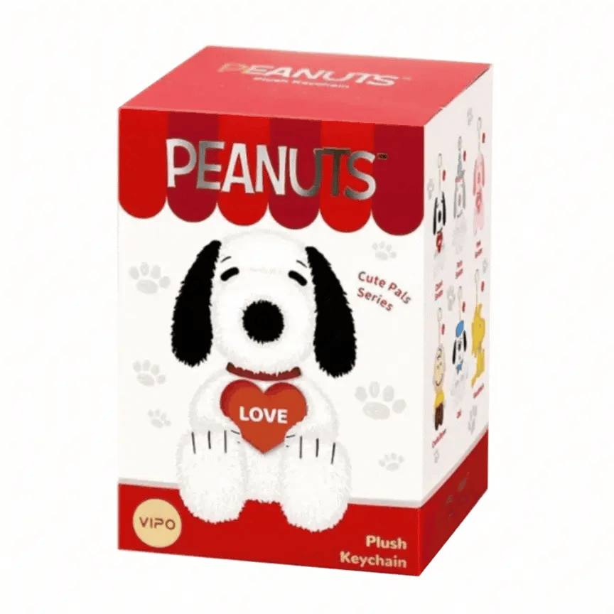 Box packaging of a Snoopy plush keychain with 'Peanuts' branding on a white background