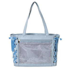 A light blue ita bag with a large clear mesh front pocket, dual shoulder straps, and decorative blue ribbon laces on the sides, shown against a plain white background.