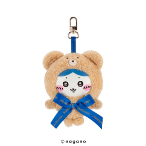 Plush keychain bear with blue ribbon and 'nagano' branding on a white background