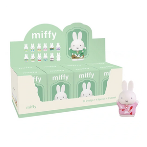Display box of Miffy figurines with a single Miffy figurine in front