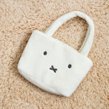 Miffy plush bag  on a beige carpet